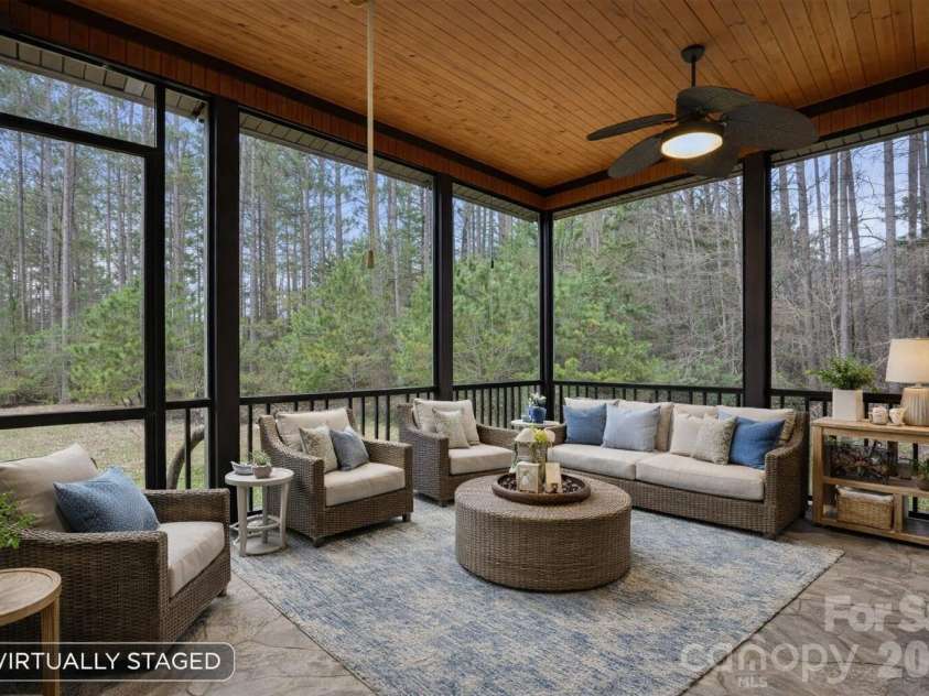 108 Washam Road, Mooresville, NC 28117.  MLS# CAR4334255, YatesRealty ID 4048. Spacious screened porch with stone flooring (Virtually Staged)