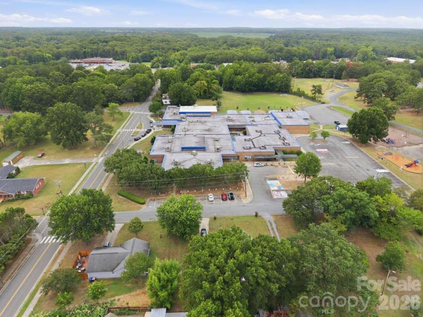 302 Elm Street, Wingate, NC 28174.  MLS# CAR4404536, YatesRealty ID 40487. Drone- above view