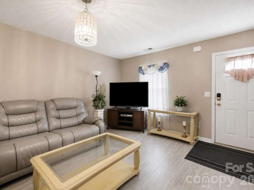 302 Elm Street, Wingate, NC 28174.  MLS# CAR4404536, YatesRealty ID 40487. Living room