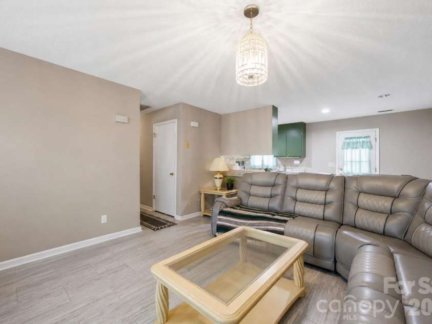 302 Elm Street, Wingate, NC 28174.  MLS# CAR4404536, YatesRealty ID 40487. Living room
