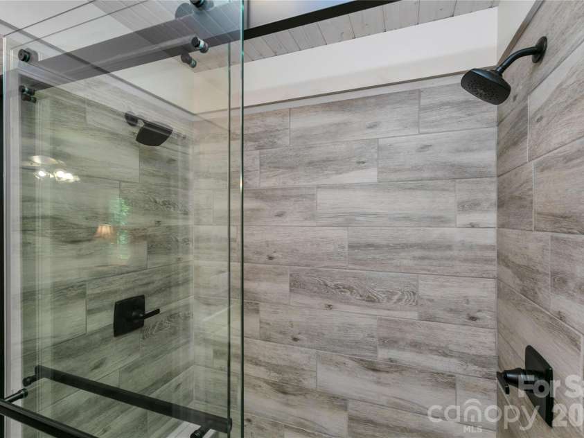 2 Duya Court, Brevard, NC 28712.  MLS# CAR4404747, YatesRealty ID 40518. Double headed shower in the Primary Bathroom