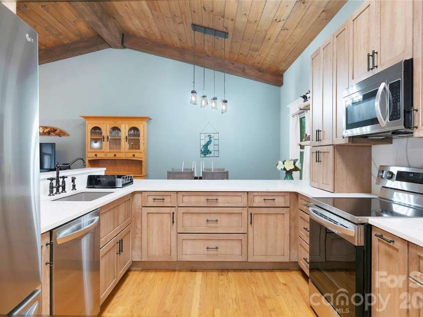 2 Duya Court, Brevard, NC 28712.  MLS# CAR4404747, YatesRealty ID 40518. View from inside the kitchen to the Dining Area