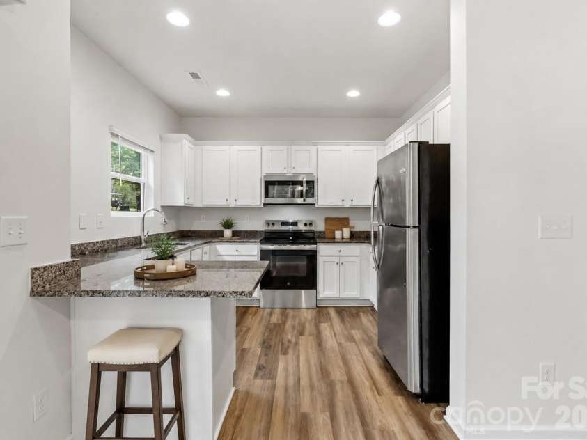 720 White Crane Road, Salisbury, NC 28146.  MLS# CAR4404297, YatesRealty ID 40531. Virtually Staged Kitchen with Granite Counters