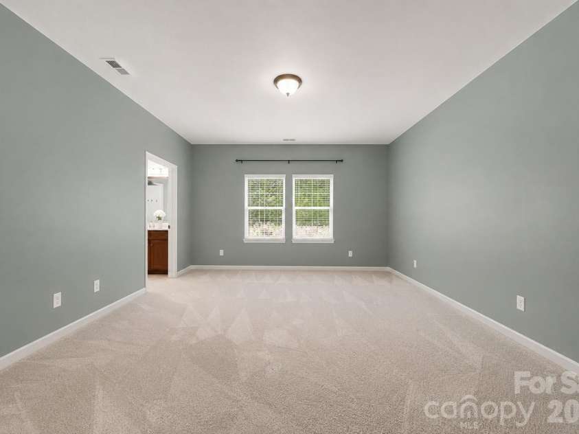 1604 Spring Blossom Trail, Fort Mill, SC 29708.  MLS# CAR4407322, YatesRealty ID 40533. Primary bedroom