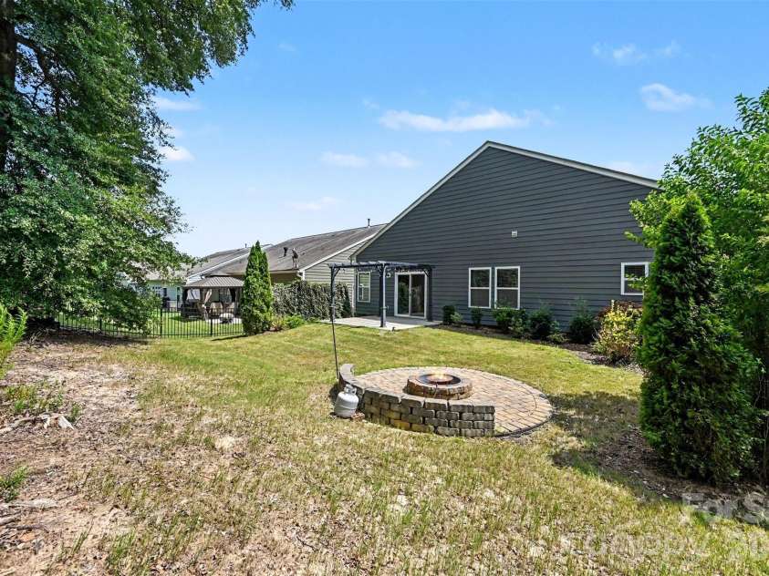 1604 Spring Blossom Trail, Fort Mill, SC 29708.  MLS# CAR4407322, YatesRealty ID 40533. Private back yard backing to HOA open space, no neighbor behind!