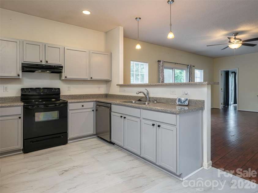 10 Ashe Road, Candler, NC 28715.  MLS# CAR4408371, YatesRealty ID 40538. Kitchen open to great room