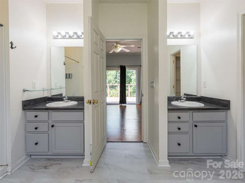10 Ashe Road, Candler, NC 28715.  MLS# CAR4408371, YatesRealty ID 40538. Separate vanities in primary bath