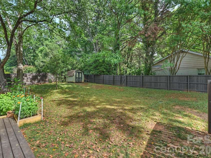 9301 Hinson Drive, Matthews, NC 28105.  MLS# CAR4405701, YatesRealty ID 40553. Rear yard