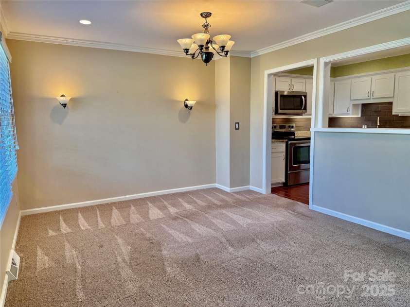 77 Chestnut Street, Tryon, NC 28782.  MLS# CAR4306733, YatesRealty ID 4057. Dining area is just off the kitchen.