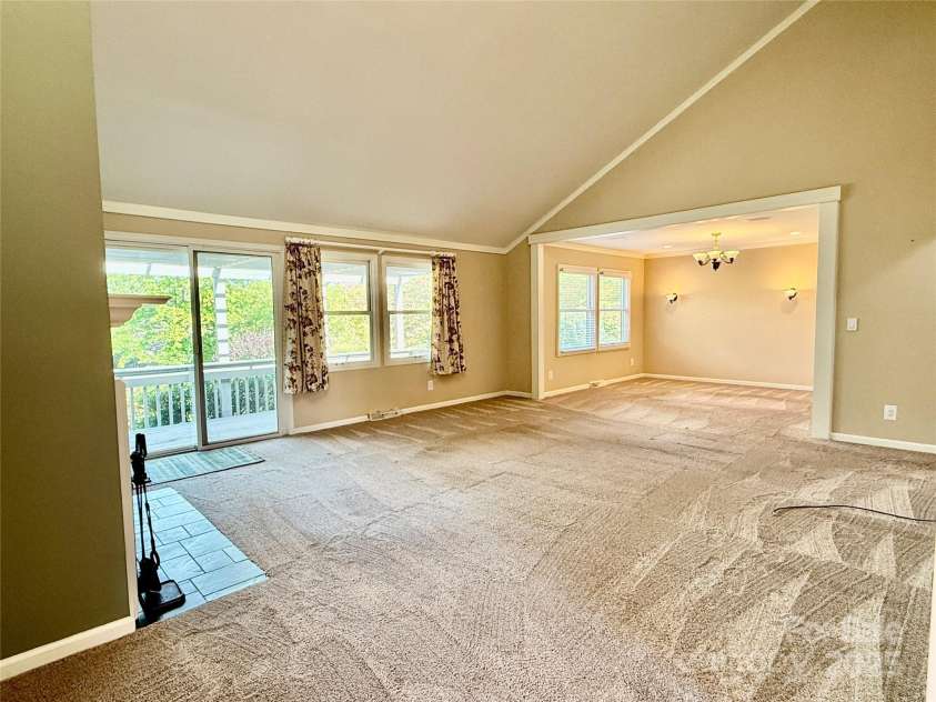 77 Chestnut Street, Tryon, NC 28782.  MLS# CAR4306733, YatesRealty ID 4057. Large living room with beautiful natural light