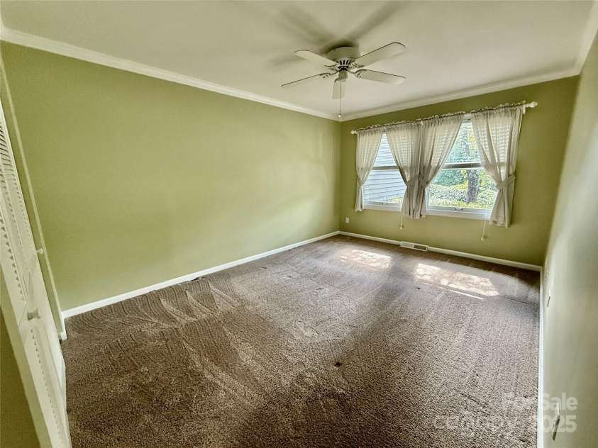 77 Chestnut Street, Tryon, NC 28782.  MLS# CAR4306733, YatesRealty ID 4057. Second bedroom with large closet.