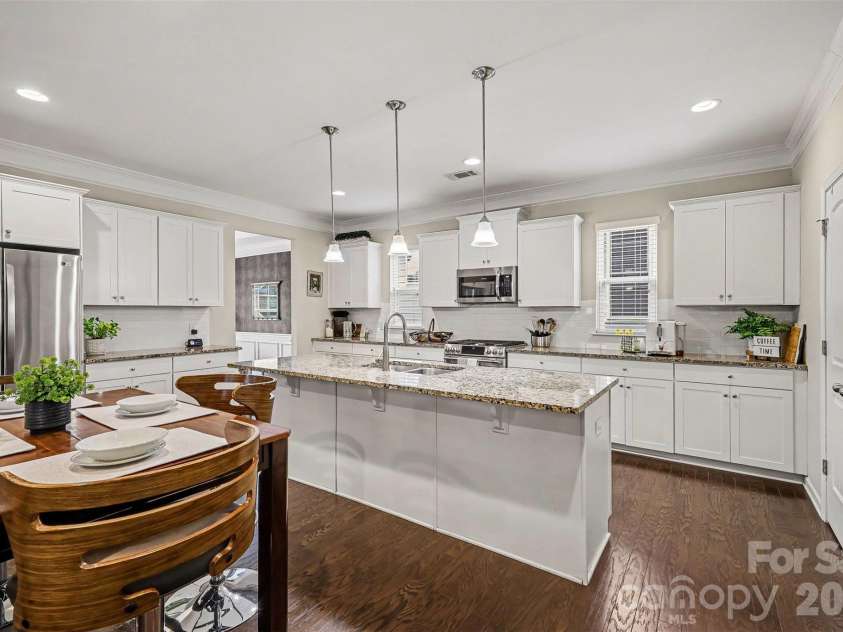 3246 Lock Erne Avenue, Kannapolis, NC 28081.  MLS# CAR4408977, YatesRealty ID 40624. Kitchen with island can be used as a bar top for extra seating.