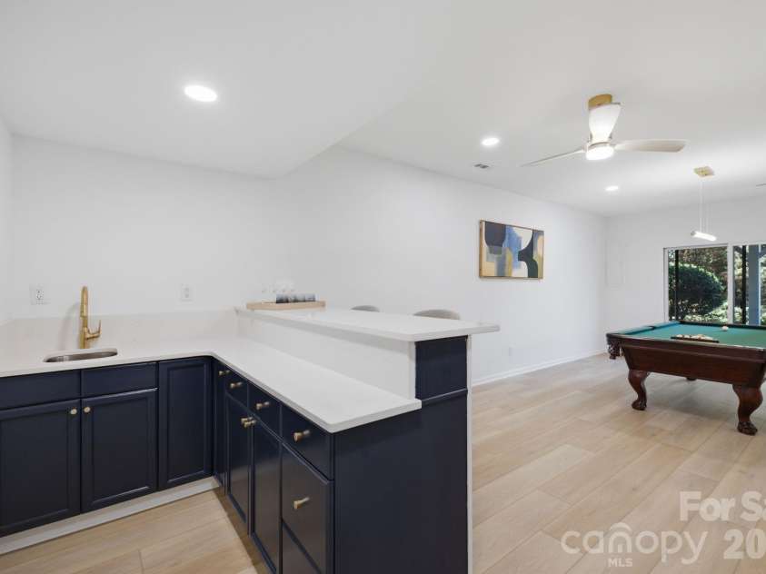 2494 Cherry Lane, Denver, NC 28037.  MLS# CAR4404242, YatesRealty ID 40664. Convenient lower-level wet bar.