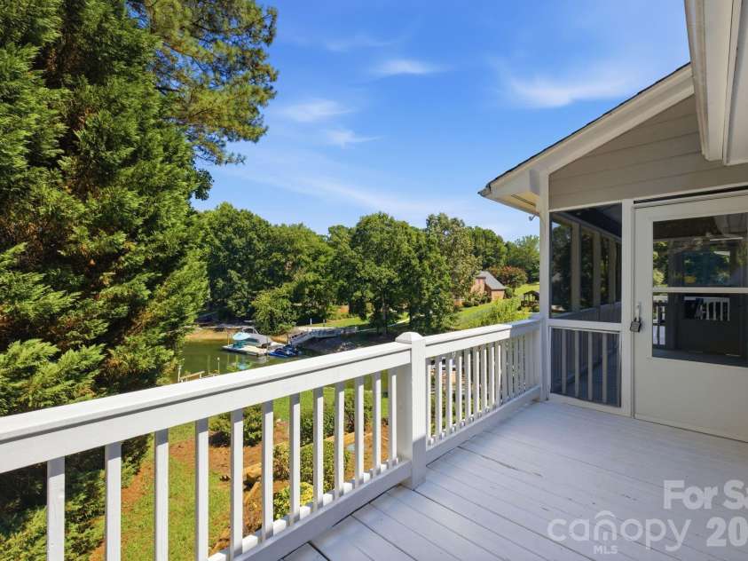 2494 Cherry Lane, Denver, NC 28037.  MLS# CAR4404242, YatesRealty ID 40664. Expansive deck off dining area perfect for entertaining.