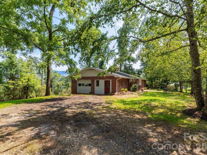 1860 Deer Park Lake Road, Spruce Pine, NC 28777.  MLS# CAR4408891, YatesRealty ID 40669. Side Yard - Mountain Views in back!