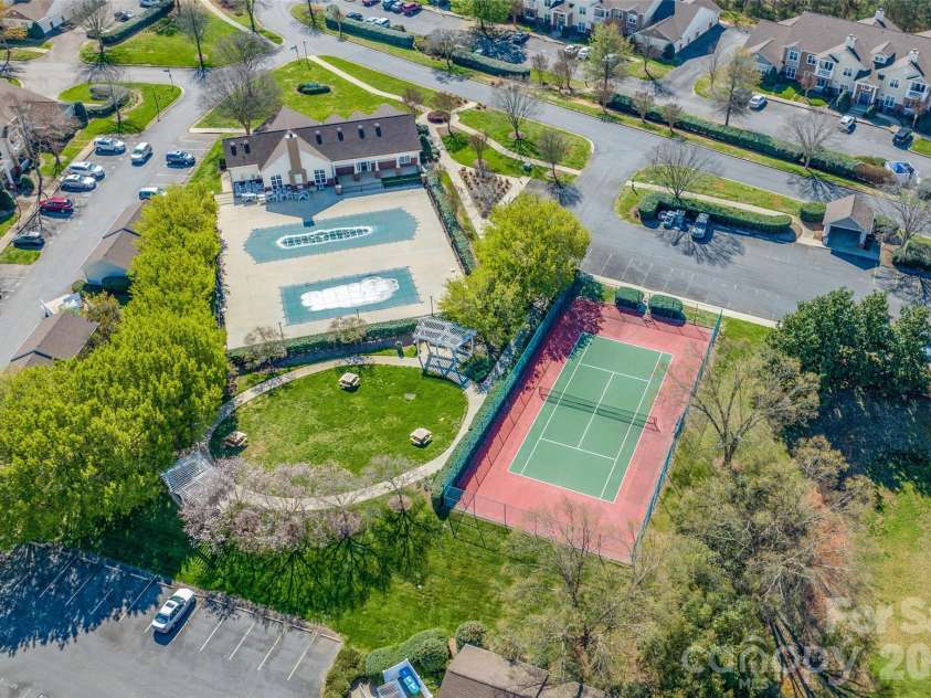 16464 Redstone Mountain Lane, Charlotte, NC 28277.  MLS# CAR4341427, YatesRealty ID 4067. Club House Rear - Two Pools - Tennis Court - Picnic area in circle and under trees