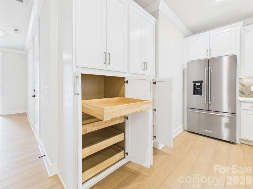 2649 Ravencroft Drive, Charlotte, NC 28208.  MLS# CAR4368827, YatesRealty ID 40729. Pantry with roll out shelves to maximize storage space.
