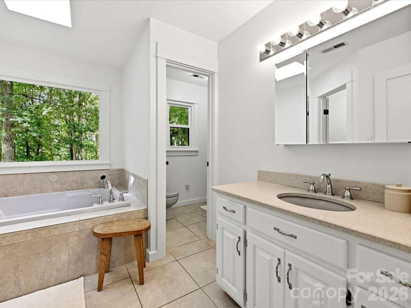 34272 Mabry Road, Albemarle, NC 28001.  MLS# CAR4407397, YatesRealty ID 40738. Primary bath with jetted tub and updated vanity