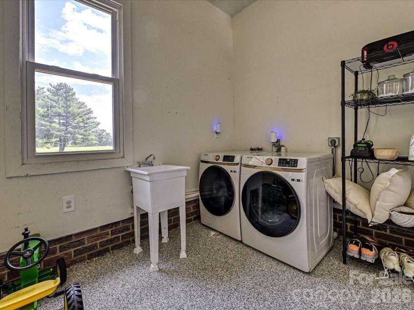 34272 Mabry Road, Albemarle, NC 28001.  MLS# CAR4407397, YatesRealty ID 40738. Rear-load garage with epoxy floor and its own mini-split plus utility sink and laundry 2