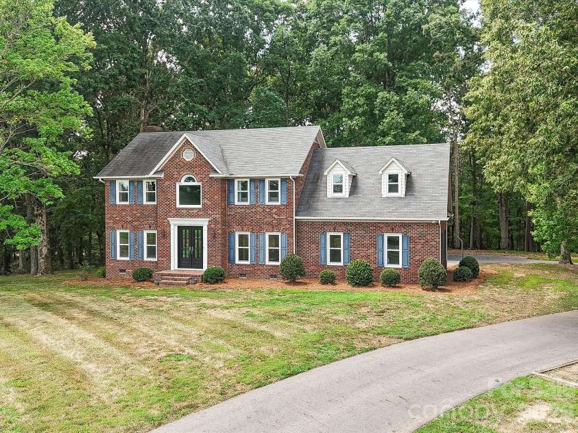 34272 Mabry Road, Albemarle, NC 28001.  MLS# CAR4407397, YatesRealty ID 40738. Traditional full-brick front elevation, move-in ready