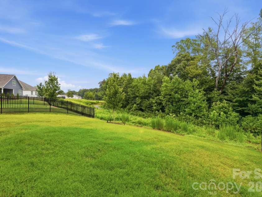 115 Shayna Road, Troutman, NC 28166.  MLS# CAR4407624, YatesRealty ID 40740. A premium homesite backs to trees and protected common space.