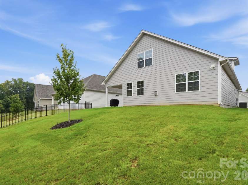 115 Shayna Road, Troutman, NC 28166.  MLS# CAR4407624, YatesRealty ID 40740. Privacy and open green views make this backyard truly special.