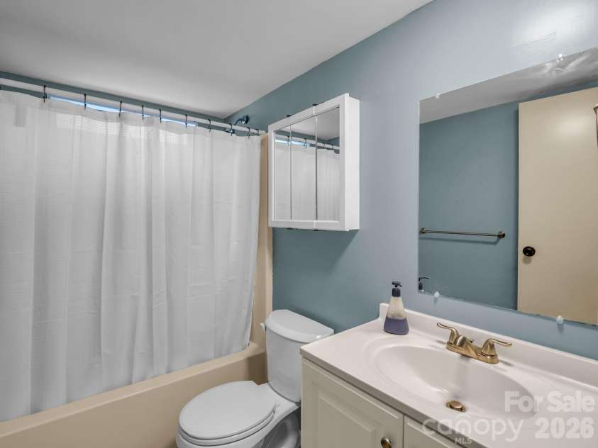 1120 Sandy Plains Road, Tryon, NC 28782.  MLS# CAR4407780, YatesRealty ID 40748. Guest Bathroom