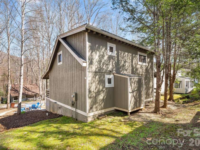 21 Susan Drive, Maggie Valley, NC 28751.  MLS# CAR4241989, YatesRealty ID 4076. Back of Home- storage sapce off the rear of home
