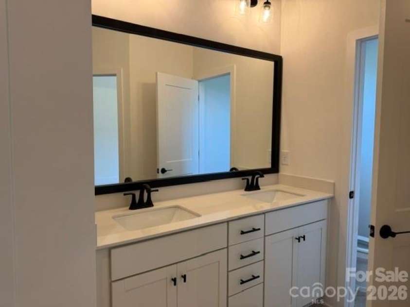 1305 Gardenia Drive, Mt Ulla, NC 28125.  MLS# CAR4410312, YatesRealty ID 40773. Double sinks in primary
