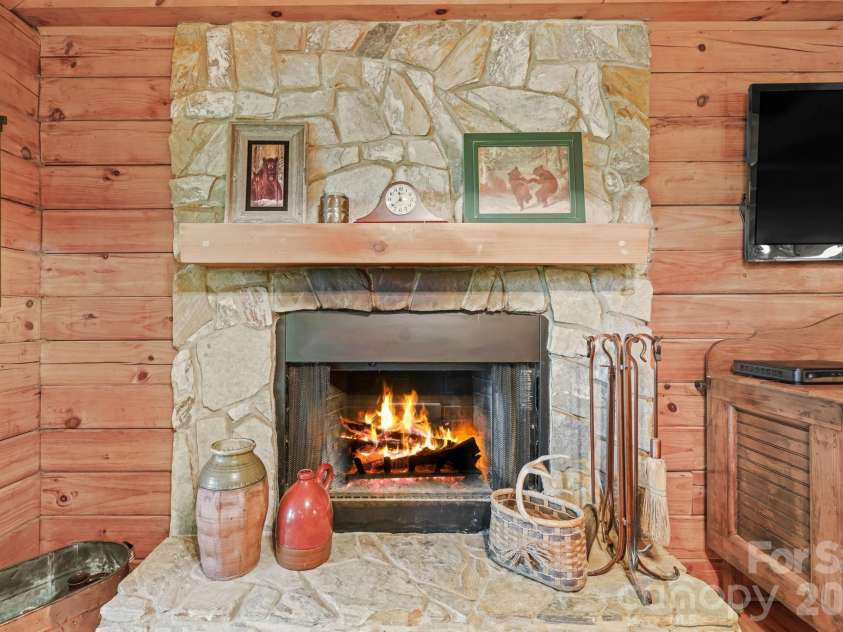 226 Signal Ridge, Sylva, NC 28779.  MLS# CAR4410234, YatesRealty ID 40786. Wood burning Rock fireplace