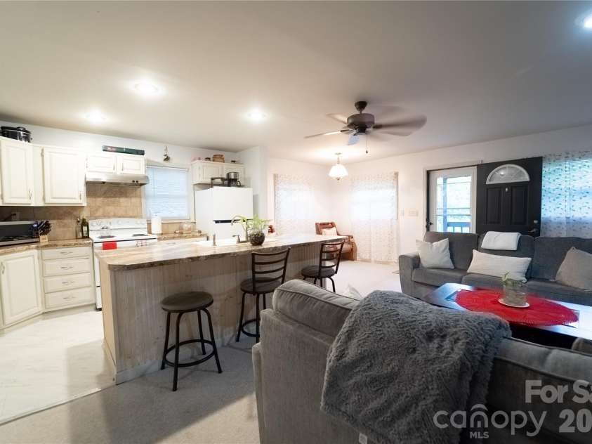 242 Whitewater Road, Sapphire, NC 28774.  MLS# CAR4410402, YatesRealty ID 40787. Kitchen/living space