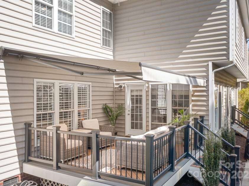 15124 Hugh Mcauley Road, Huntersville, NC 28078.  MLS# CAR4234988, YatesRealty ID 4079. Deck with awning extended creates a lovely outdoor space on a sunny day