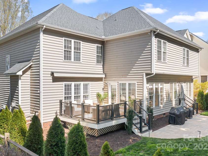 15124 Hugh Mcauley Road, Huntersville, NC 28078.  MLS# CAR4234988, YatesRealty ID 4079. Fully fenced, private backyard. Composite deck, stone patio. Deck has a retractable awning for shade on a hot summer day.