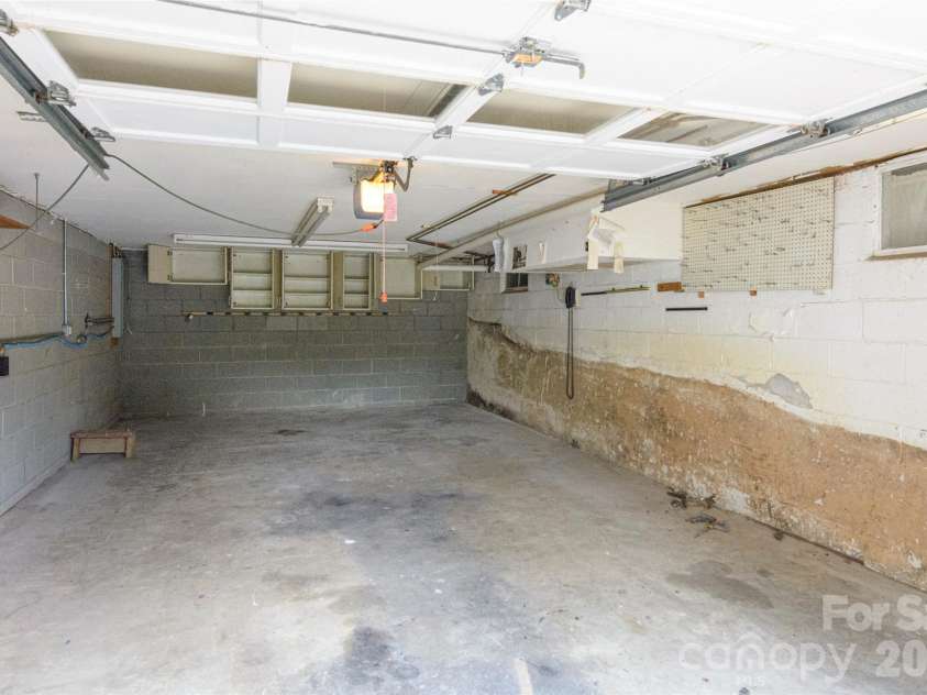 352 Cedar Lane, Arden, NC 28704.  MLS# CAR4391358, YatesRealty ID 40799. Basement Garage One