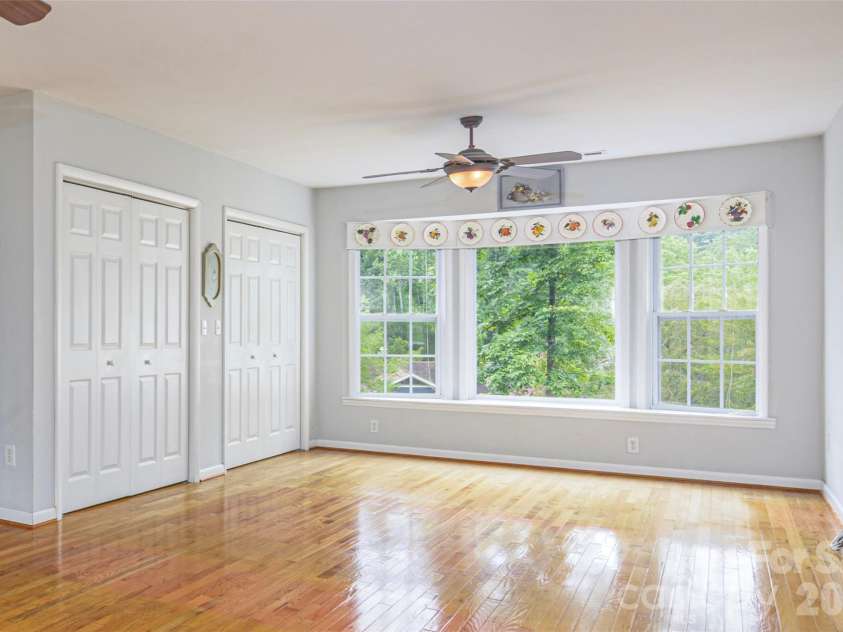 352 Cedar Lane, Arden, NC 28704.  MLS# CAR4391358, YatesRealty ID 40799. Den with bay window, closet, and washer dryer
