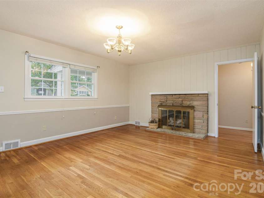 352 Cedar Lane, Arden, NC 28704.  MLS# CAR4391358, YatesRealty ID 40799. Dining Room Fireplace