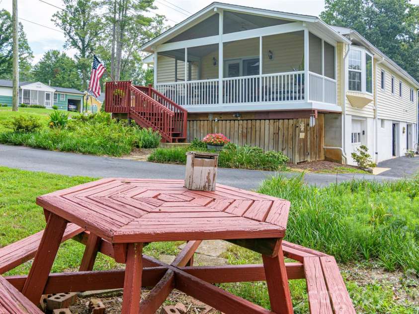 352 Cedar Lane, Arden, NC 28704.  MLS# CAR4391358, YatesRealty ID 40799. Screened Deck Entrance from Side