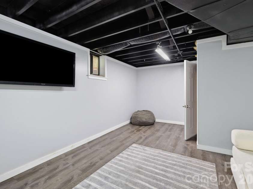 202 Riva Ridge Drive, Fairview, NC 28730.  MLS# CAR4397168, YatesRealty ID 40805. Basement den