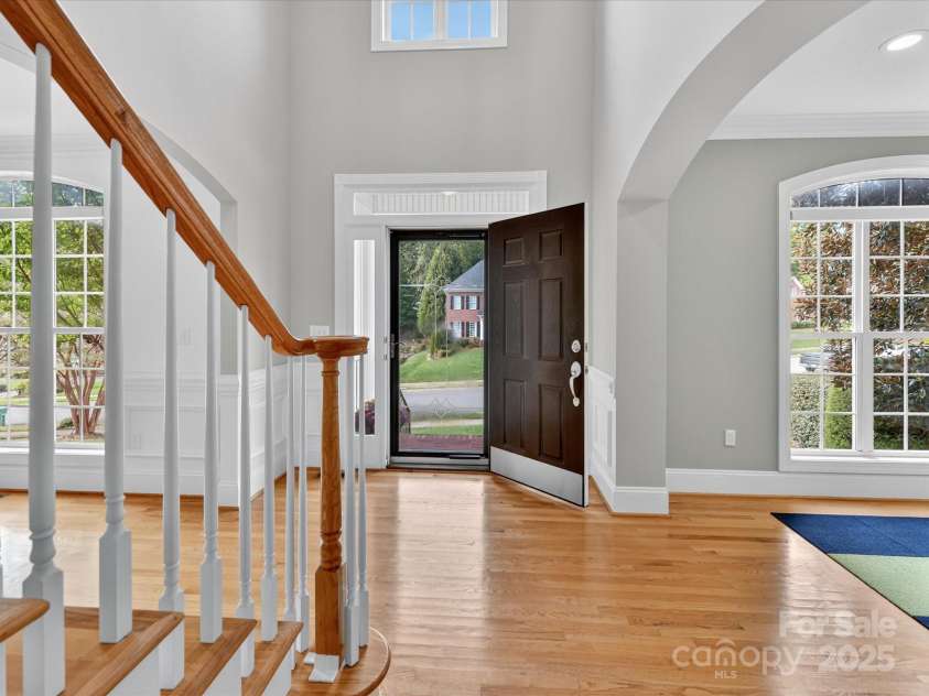 10007 Devereaux Drive, Matthews, NC 28105.  MLS# CAR4307264, YatesRealty ID 40812. Entrance with a storm door
