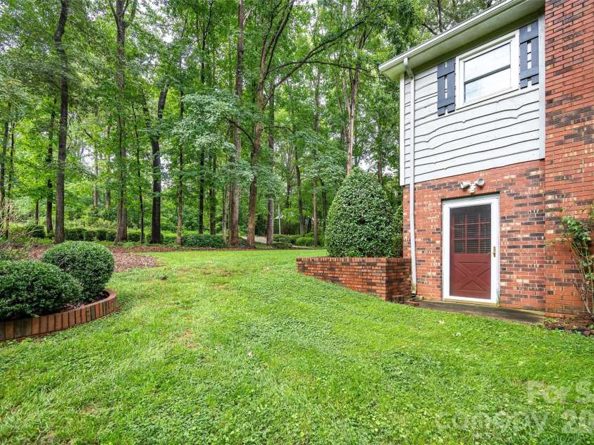 2602 Shearer Drive, Statesville, NC 28625.  MLS# CAR4408375, YatesRealty ID 40815. Side yard area