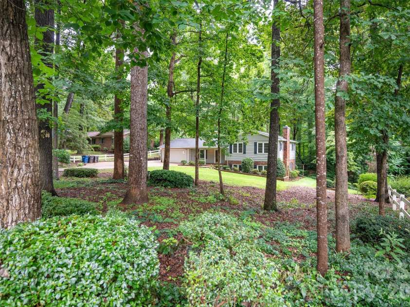 2602 Shearer Drive, Statesville, NC 28625.  MLS# CAR4408375, YatesRealty ID 40815. Vinyl split rail fence on each side.