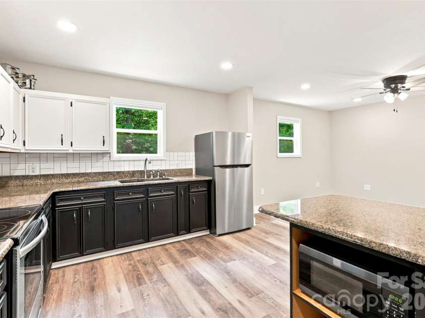 6707 Providence Road, Waxhaw, NC 28173.  MLS# CAR4408651, YatesRealty ID 40831. Unpermitted Garage kitchen and living area
