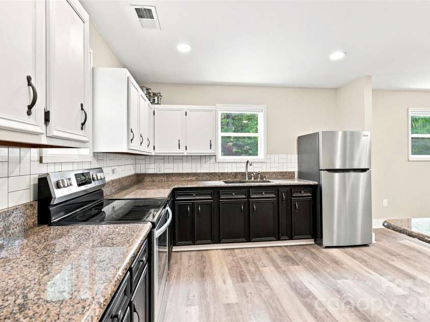 6707 Providence Road, Waxhaw, NC 28173.  MLS# CAR4408651, YatesRealty ID 40831. Unpermitted Garage kitchen and living area