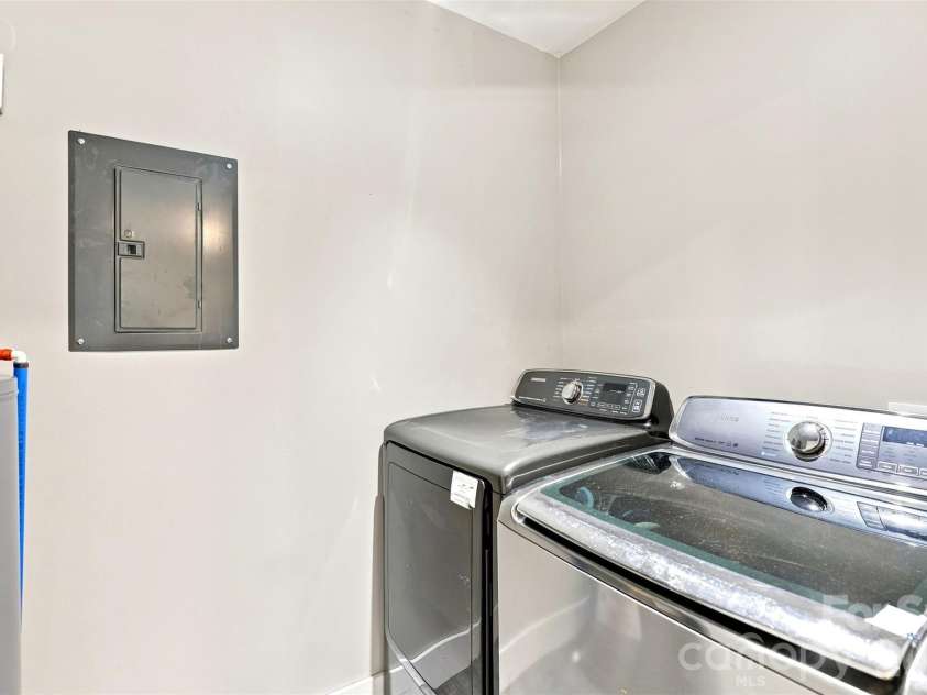 6707 Providence Road, Waxhaw, NC 28173.  MLS# CAR4408651, YatesRealty ID 40831. Unpermitted laundry in garage main level