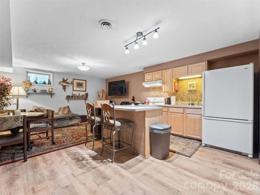 3 Westbridge Drive, Hendersonville, NC 28739.  MLS# CAR4398725, YatesRealty ID 40837. Great Room in Basement