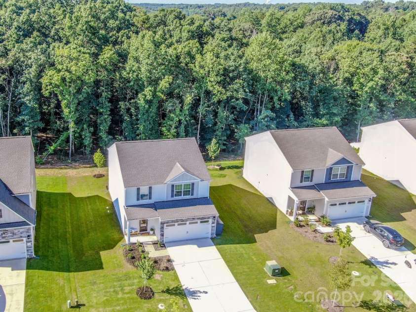 119 Brixham Loop, Troutman, NC 28166.  MLS# CAR4410222, YatesRealty ID 40876. Lovely woods