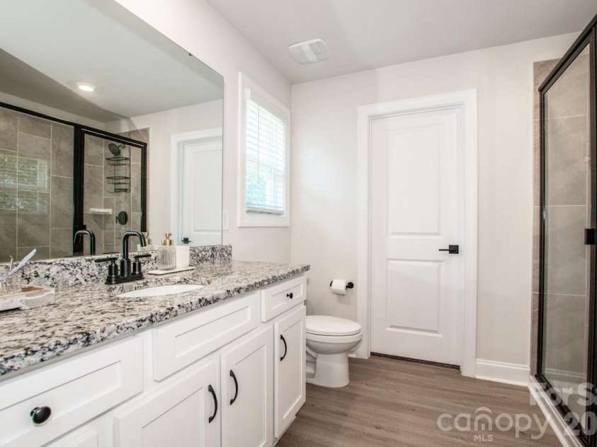 119 Brixham Loop, Troutman, NC 28166.  MLS# CAR4410222, YatesRealty ID 40876. Nice Size Vanity with Large Walk-in shower