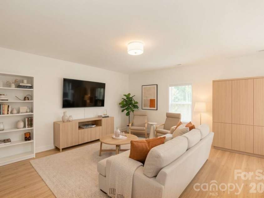 119 Brixham Loop, Troutman, NC 28166.  MLS# CAR4410222, YatesRealty ID 40876. Staged Living Room