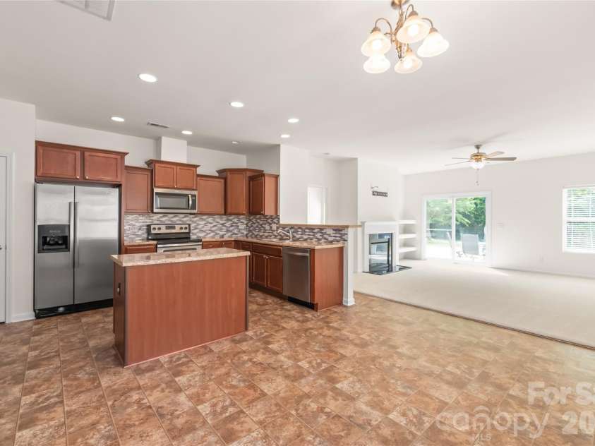 8411 Romana Red Lane, Charlotte, NC 28213.  MLS# CAR4406606, YatesRealty ID 40895. Kitchen that opens up to ample dining space  and the living room makes for a great open floorplan.