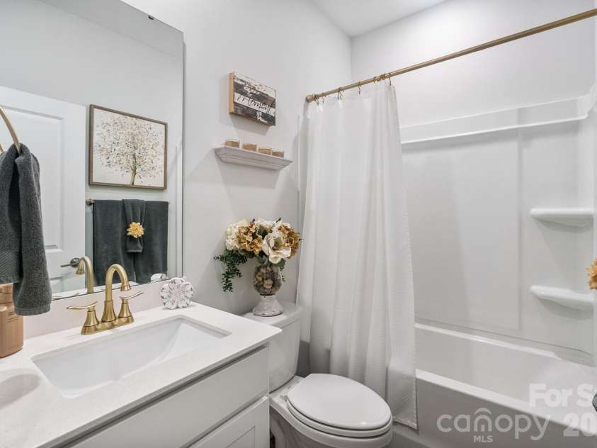 1002 Westminster Drive, Statesville, NC 28677.  MLS# CAR4400811, YatesRealty ID 40917. Hall Bathroom